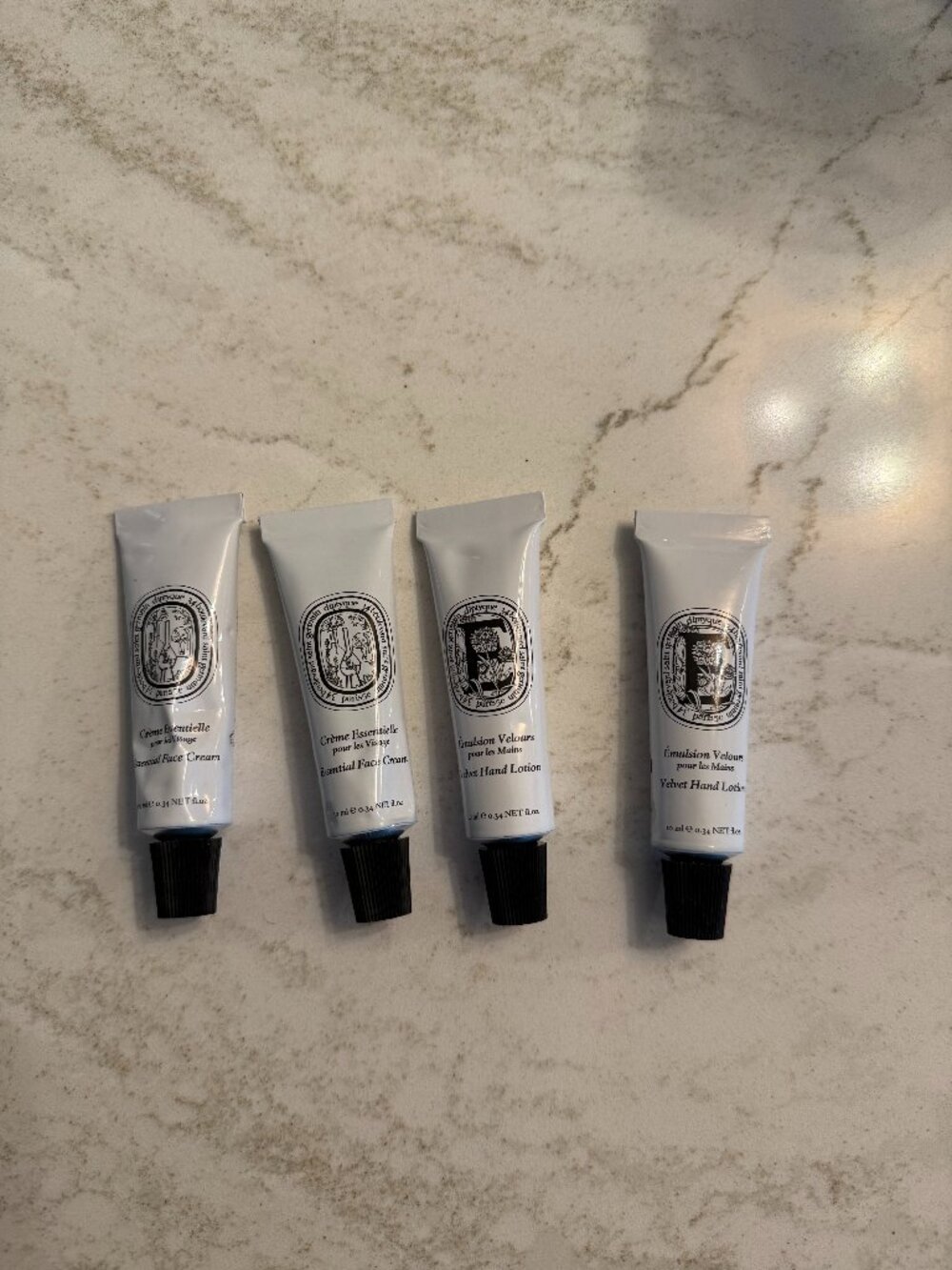 Diptyque Set of Essential Cremes for Face and Body.